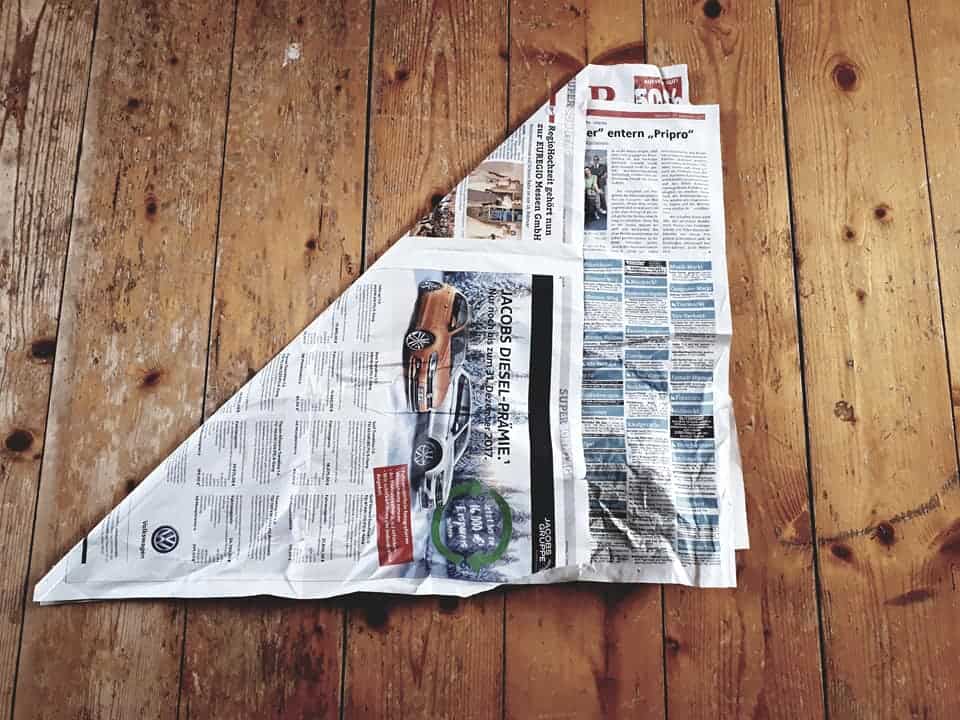 Folding garbage bags from newspaper