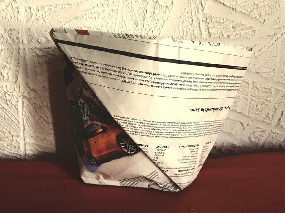 Folding garbage bags from newspaper