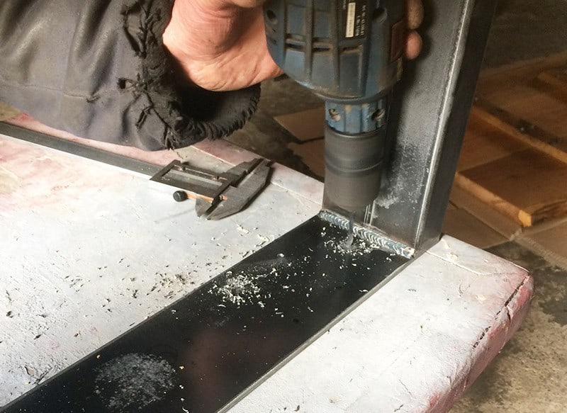 Drill holes in metal skids