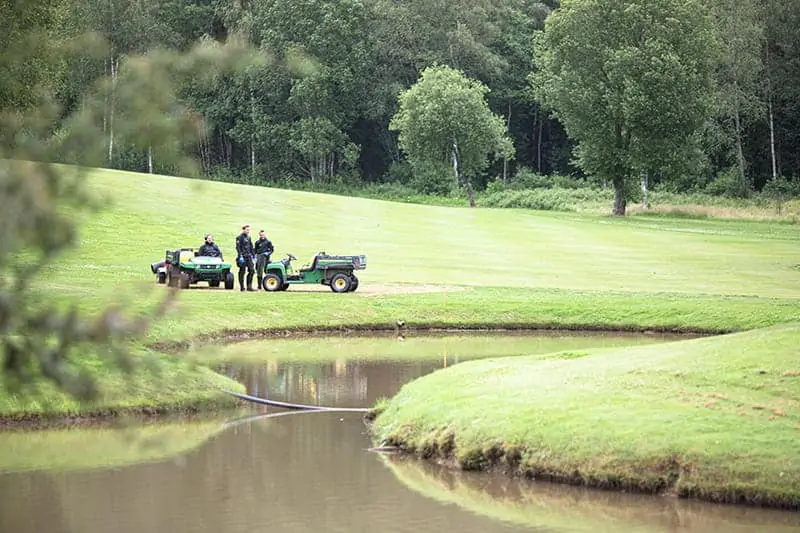 Golf ball diver fishing for golf balls