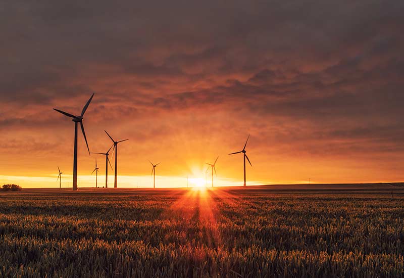 Wind turbines at sunset