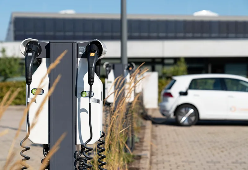 An electric charging point in the parking lot of a company