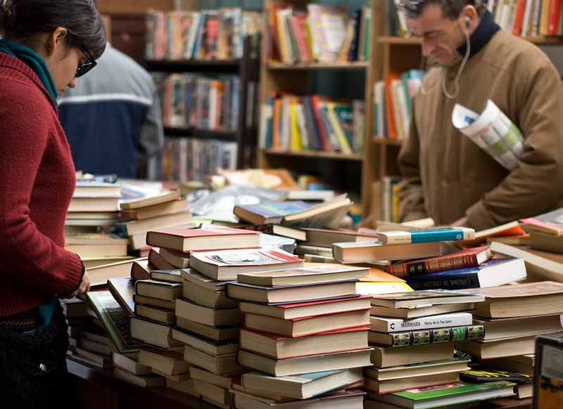 Woman and man buy second hand books