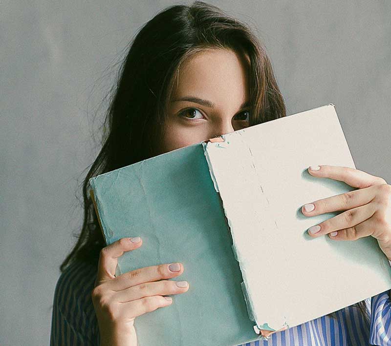 Woman looking over a book